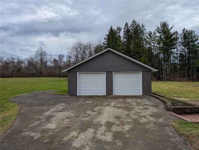 garage featuring a yard