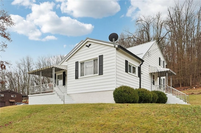 view of home's exterior featuring a yard