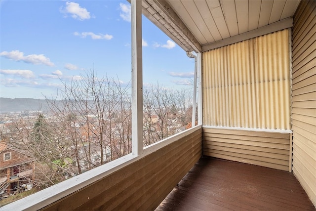 unfurnished sunroom featuring a mountain view