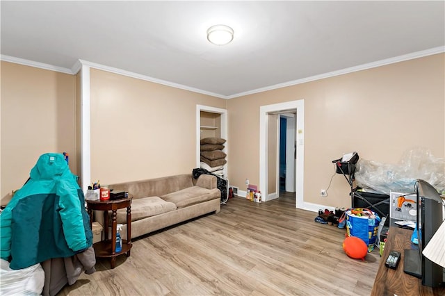 living room with hardwood / wood-style floors and ornamental molding