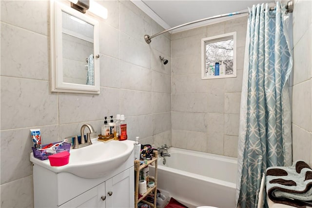 full bathroom featuring shower / bath combo, crown molding, toilet, vanity, and tile walls