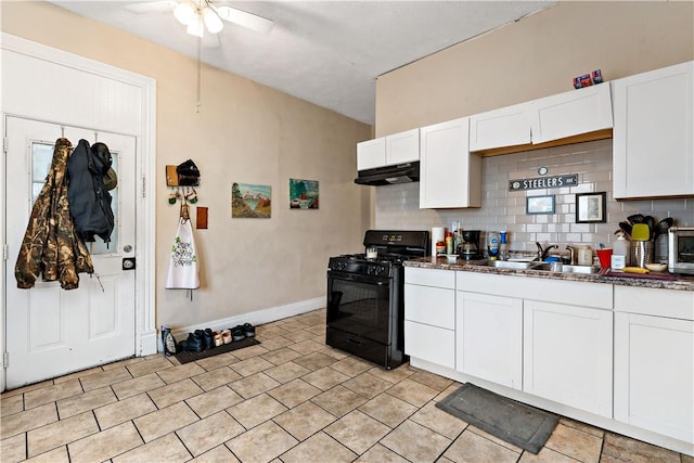 kitchen featuring tasteful backsplash, ceiling fan, sink, white cabinets, and black gas stove