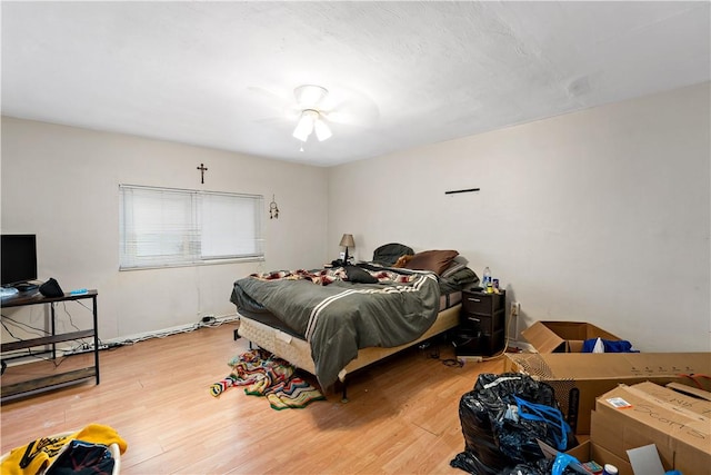 bedroom with hardwood / wood-style flooring