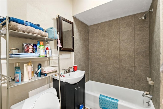 full bathroom with vanity, toilet, and tiled shower / bath