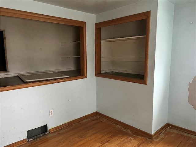 spare room featuring hardwood / wood-style flooring