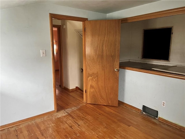 spare room with light hardwood / wood-style flooring