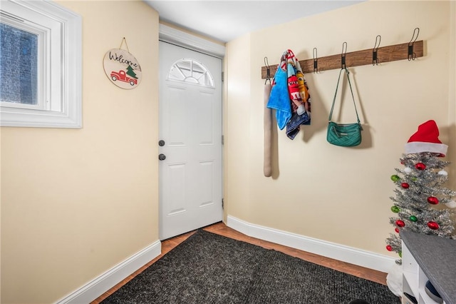 doorway with hardwood / wood-style floors