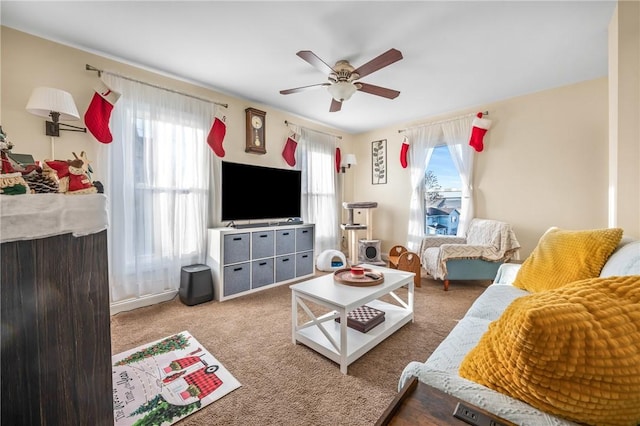 carpeted living room featuring ceiling fan