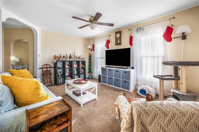 living room with carpet flooring and ceiling fan