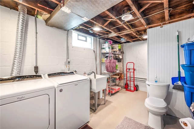 clothes washing area featuring washer and dryer