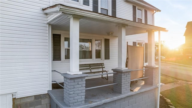 exterior entry at dusk with a porch