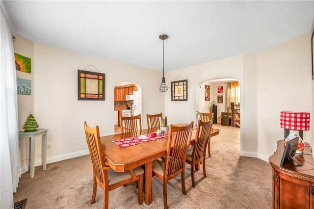 view of carpeted dining area