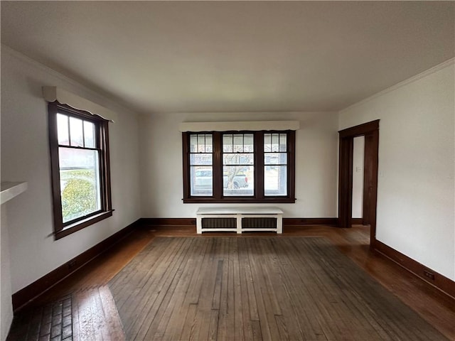 unfurnished room with dark hardwood / wood-style flooring