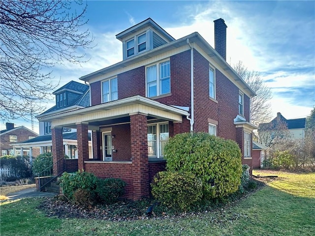 view of property exterior with covered porch and a lawn