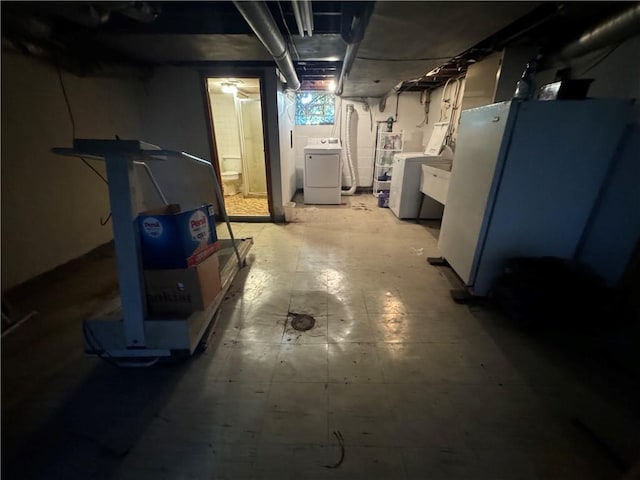 basement featuring washer and clothes dryer