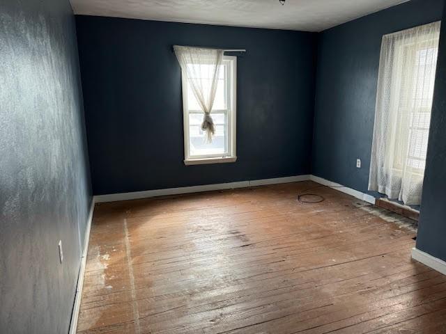 empty room with wood-type flooring