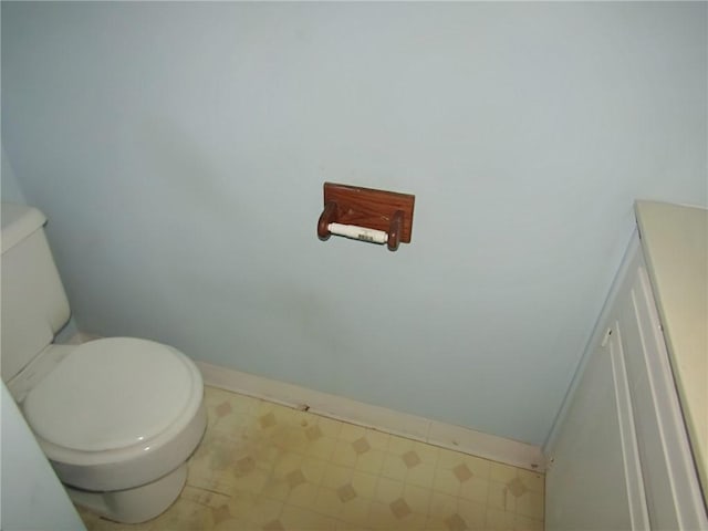 bathroom with tile patterned flooring and toilet