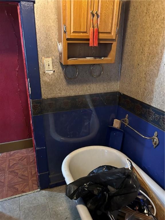 bathroom with tile patterned floors