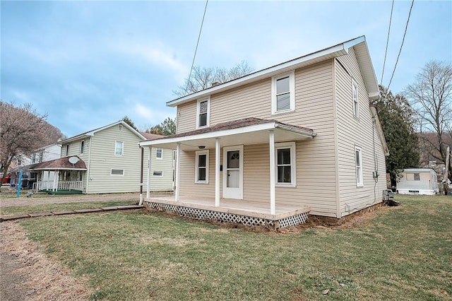 view of front of home with a front yard and a porch