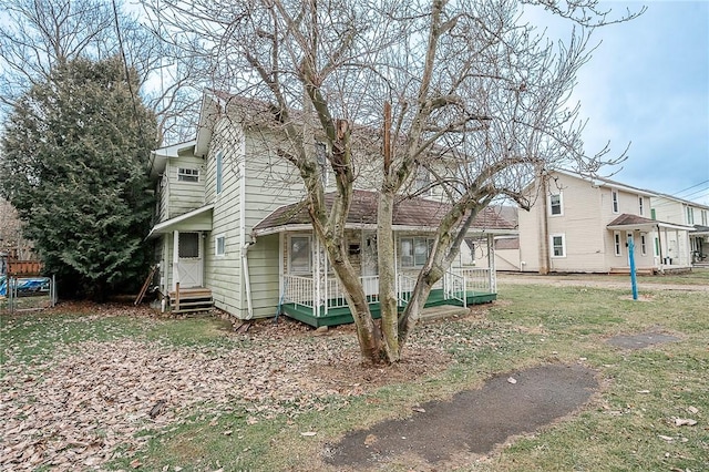 exterior space with a front lawn and covered porch