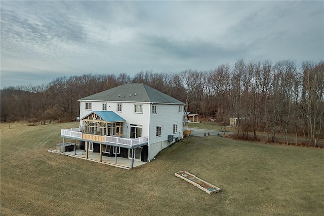 585 State Route 2007, Cowanshanock Twp, PA 16201 - back of property with a lawn, a wooden deck, a sunroom, and a patio