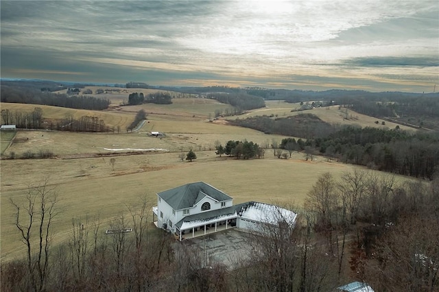 aerial view at dusk featuring a rural view