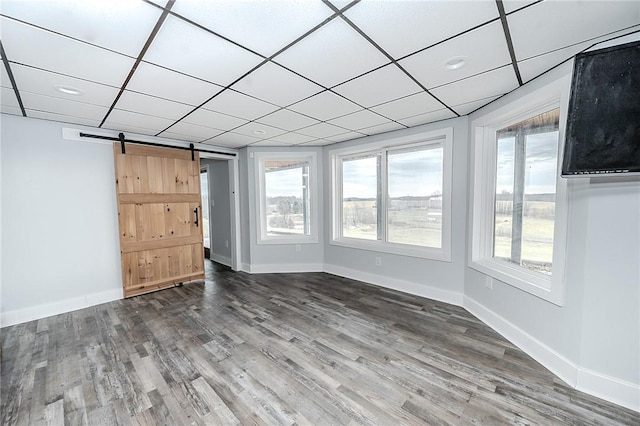 585 State Route 2007, Cowanshanock Twp, PA 16201 - empty room with wood finished floors, a barn door, and a drop ceiling