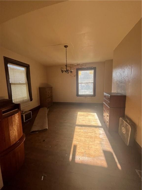 dining area featuring a chandelier and lofted ceiling