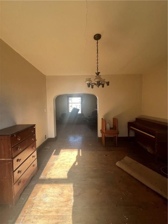 interior space with hardwood / wood-style flooring and a notable chandelier