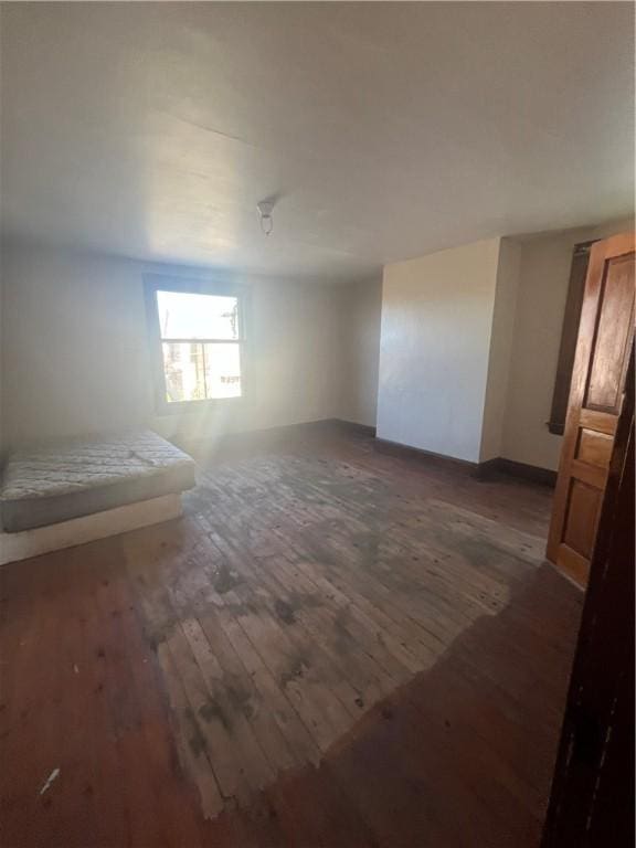 unfurnished room featuring dark hardwood / wood-style flooring