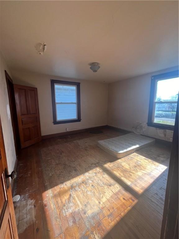 unfurnished room featuring dark hardwood / wood-style floors