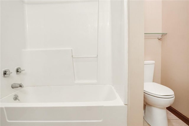 bathroom featuring tile patterned floors, toilet, and shower / bath combination