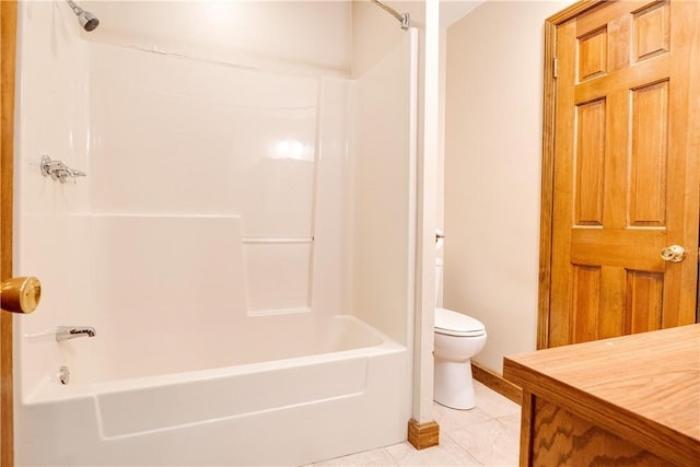 bathroom with tile patterned floors, shower / bathing tub combination, and toilet