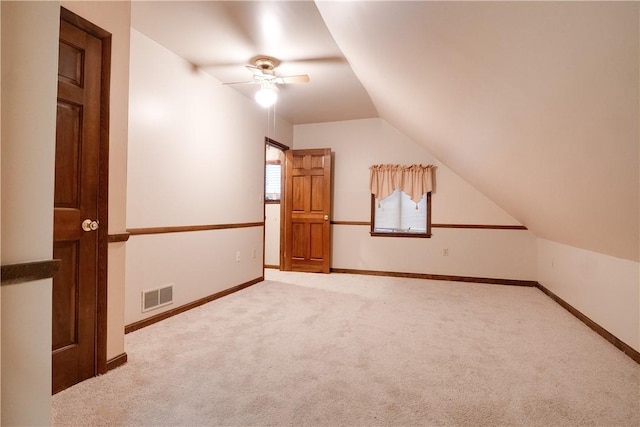 bonus room featuring lofted ceiling, ceiling fan, and carpet floors