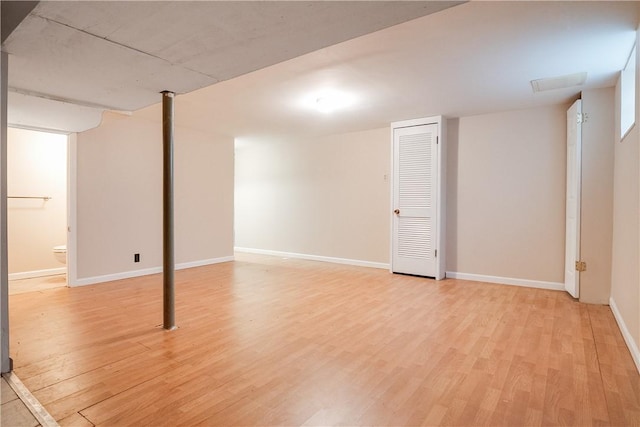 basement featuring light wood-type flooring