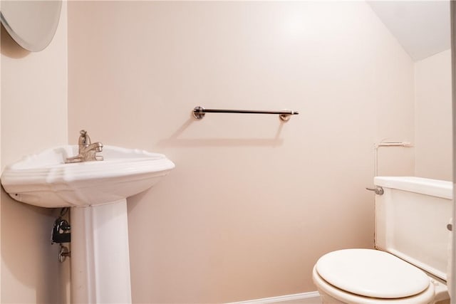 bathroom featuring toilet and vaulted ceiling