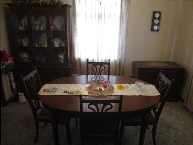 view of carpeted dining space