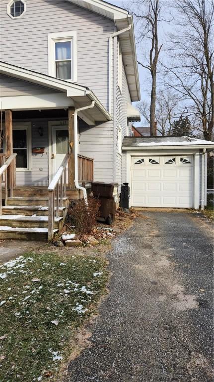 view of property exterior featuring a porch