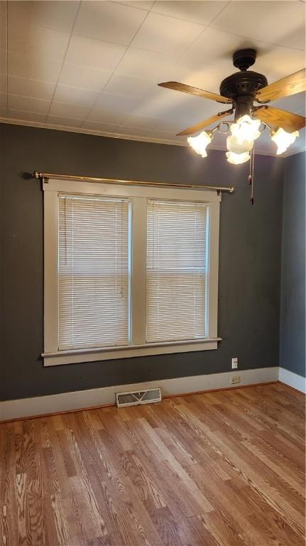 spare room featuring ceiling fan and light hardwood / wood-style flooring