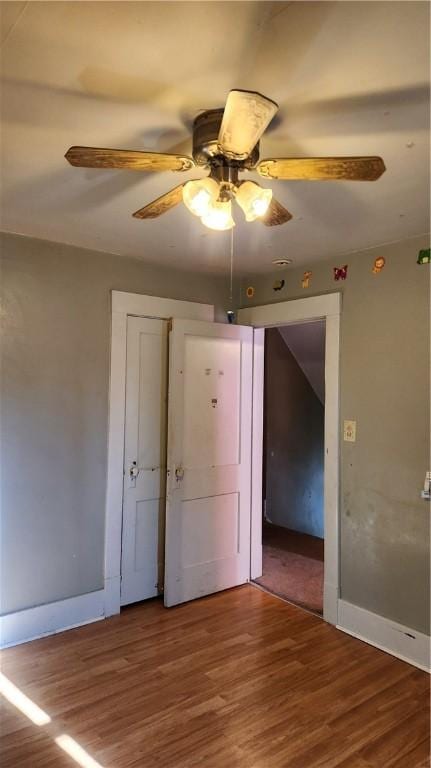 unfurnished bedroom featuring ceiling fan and hardwood / wood-style floors