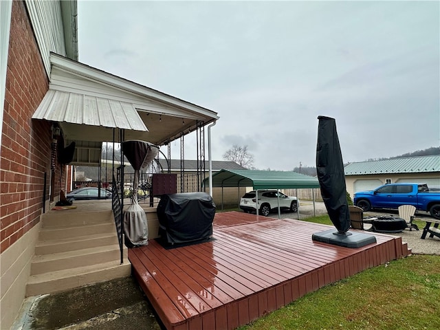 deck featuring a grill and a carport