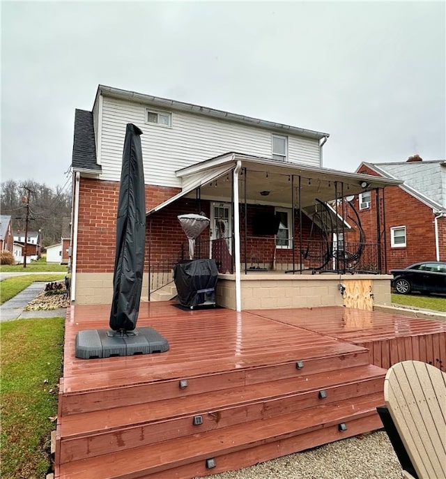 back of house with a wooden deck