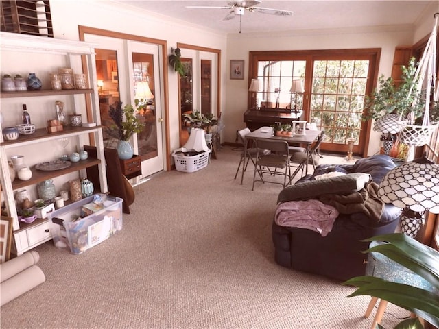 sunroom featuring french doors and ceiling fan