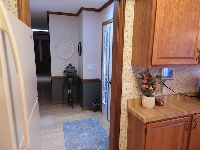 hallway featuring crown molding