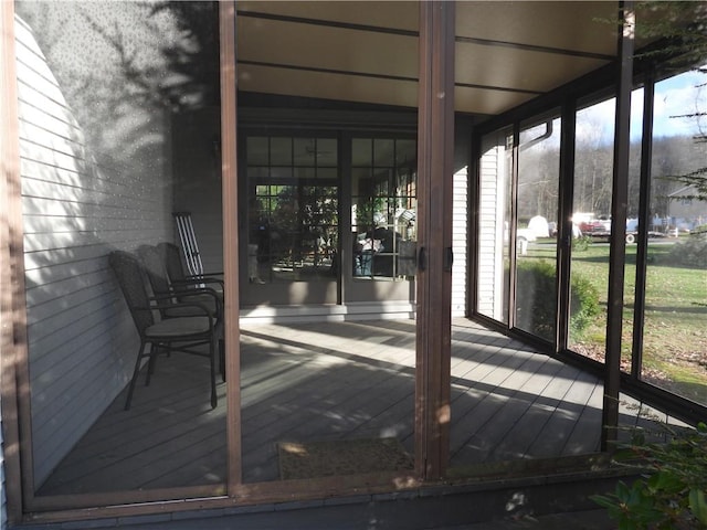 unfurnished sunroom featuring plenty of natural light