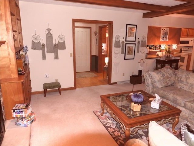 living room featuring beamed ceiling and light carpet