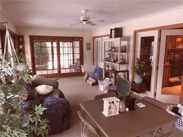 interior space with ceiling fan and crown molding