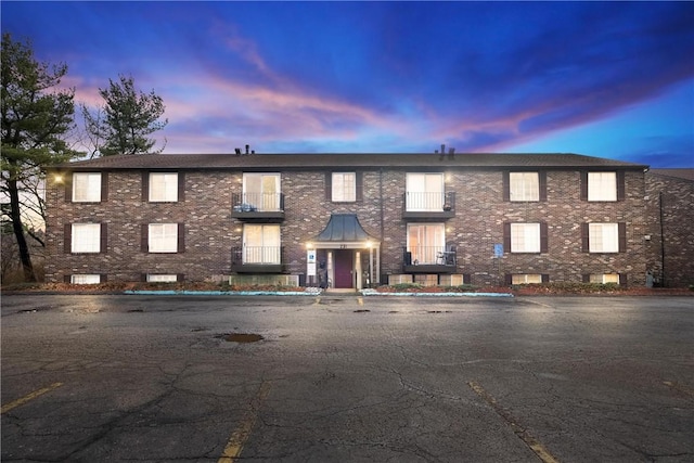 view of outdoor building at dusk