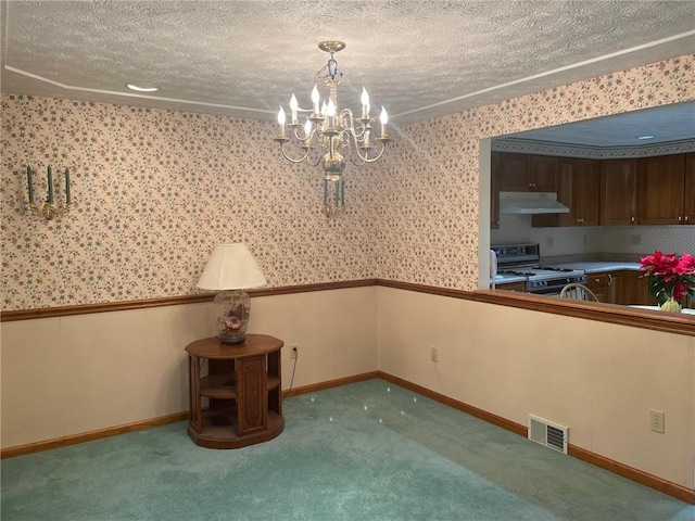 unfurnished dining area with carpet flooring, a textured ceiling, and an inviting chandelier