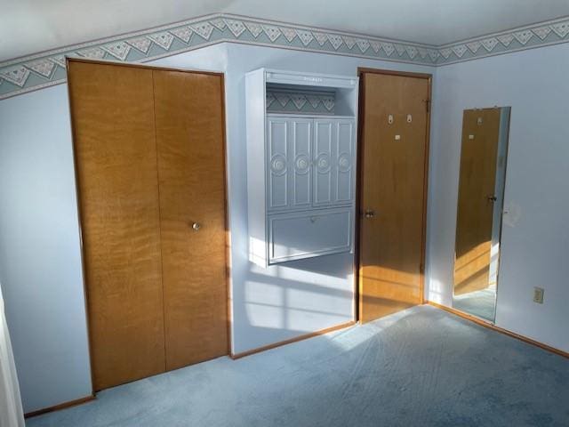 unfurnished bedroom featuring a closet and carpet flooring